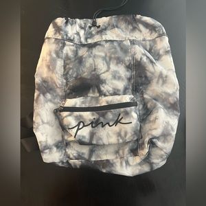 Victoria secret PINK backpack with adjustable top strap and zipper pockets.